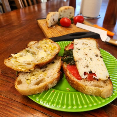 Toast topped with farm cheese and tomato