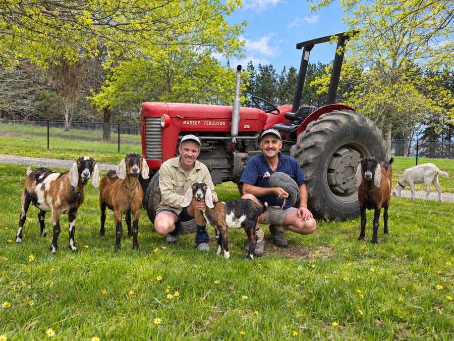 Matthew Chavasse and Marco Xuereb with their goats beside the tractor at Yerrabi